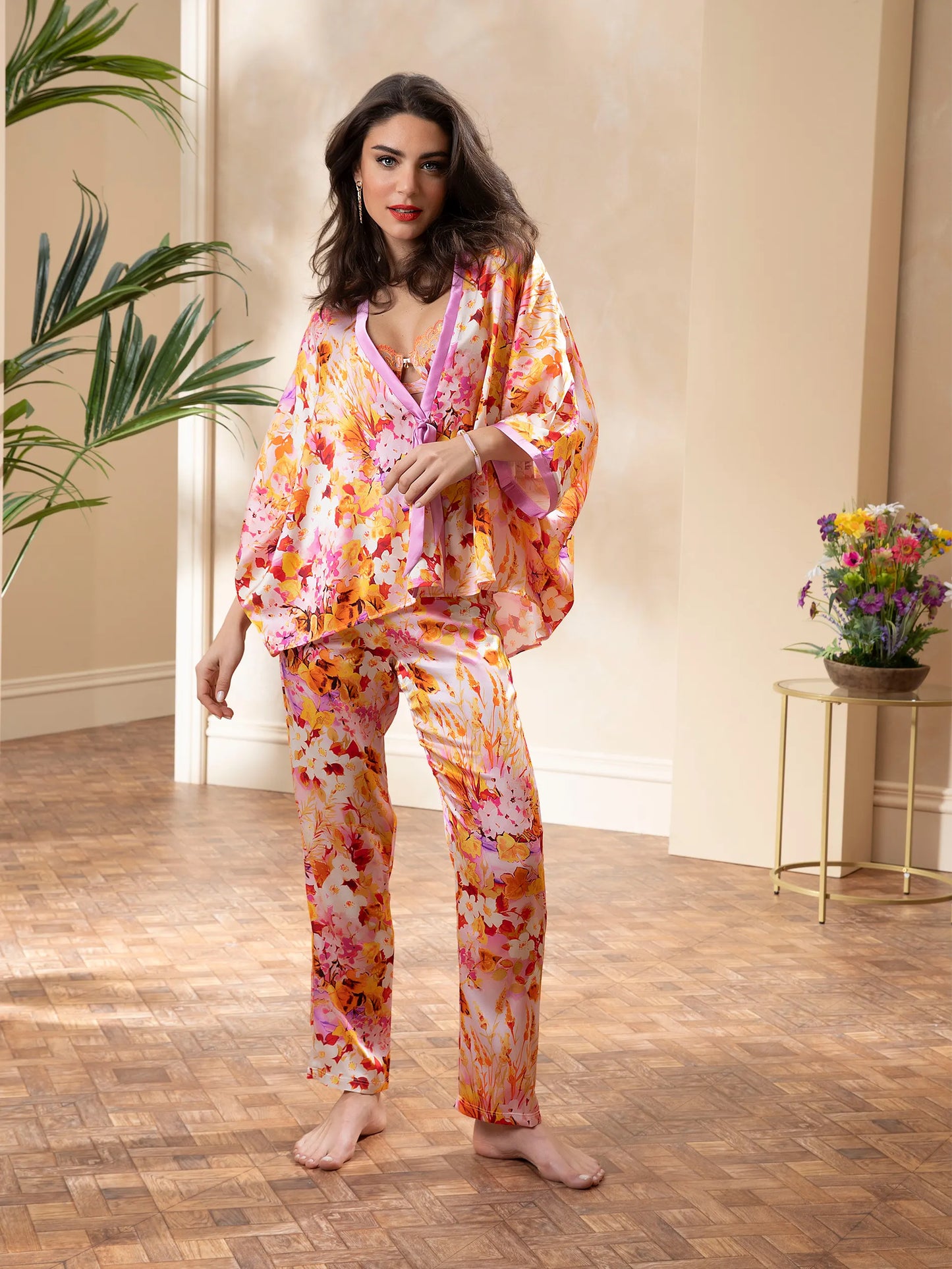 Women is wearing Jardins de Lumière Silk Kimono in combination with matching bra and panties sold separately.