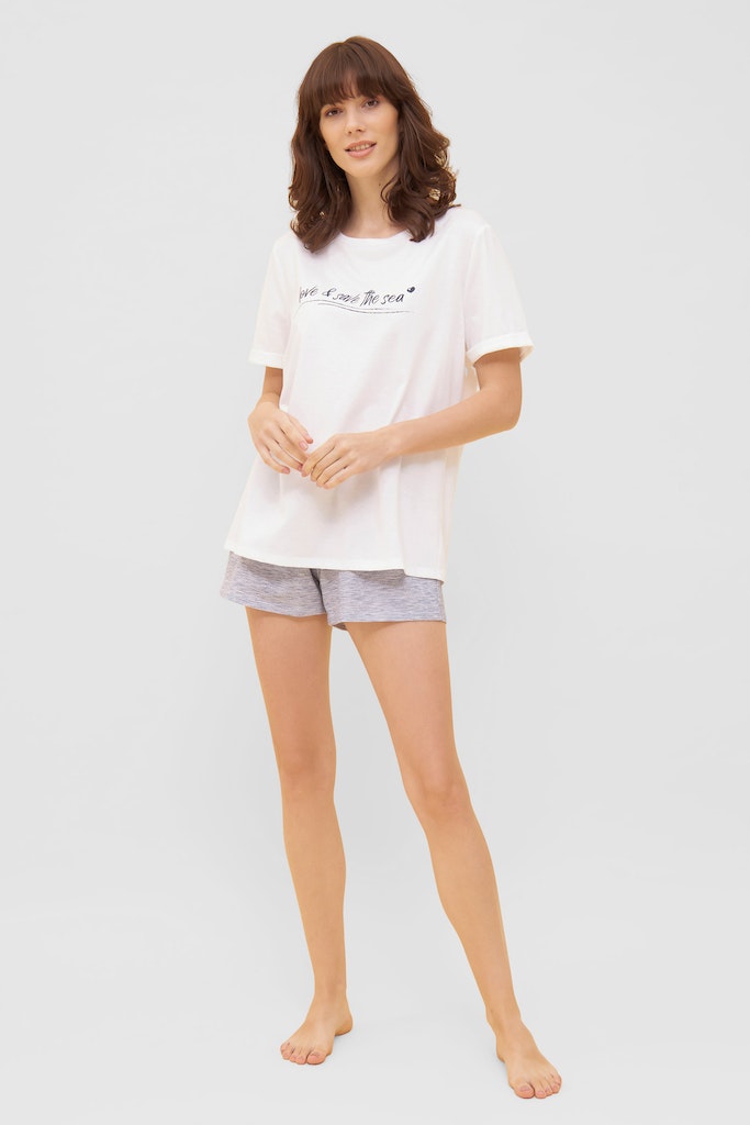 Women is wearing Be Happy Jersey Cotton Loose T-Shirt front picture with matching shorts (sold separately)