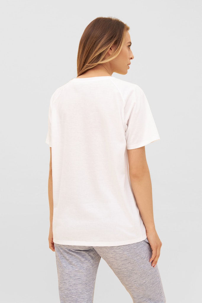 Women is wearing Be Happy Jersey Cotton Classic T-Shirt back picture with matching bottom ( sold separately)
