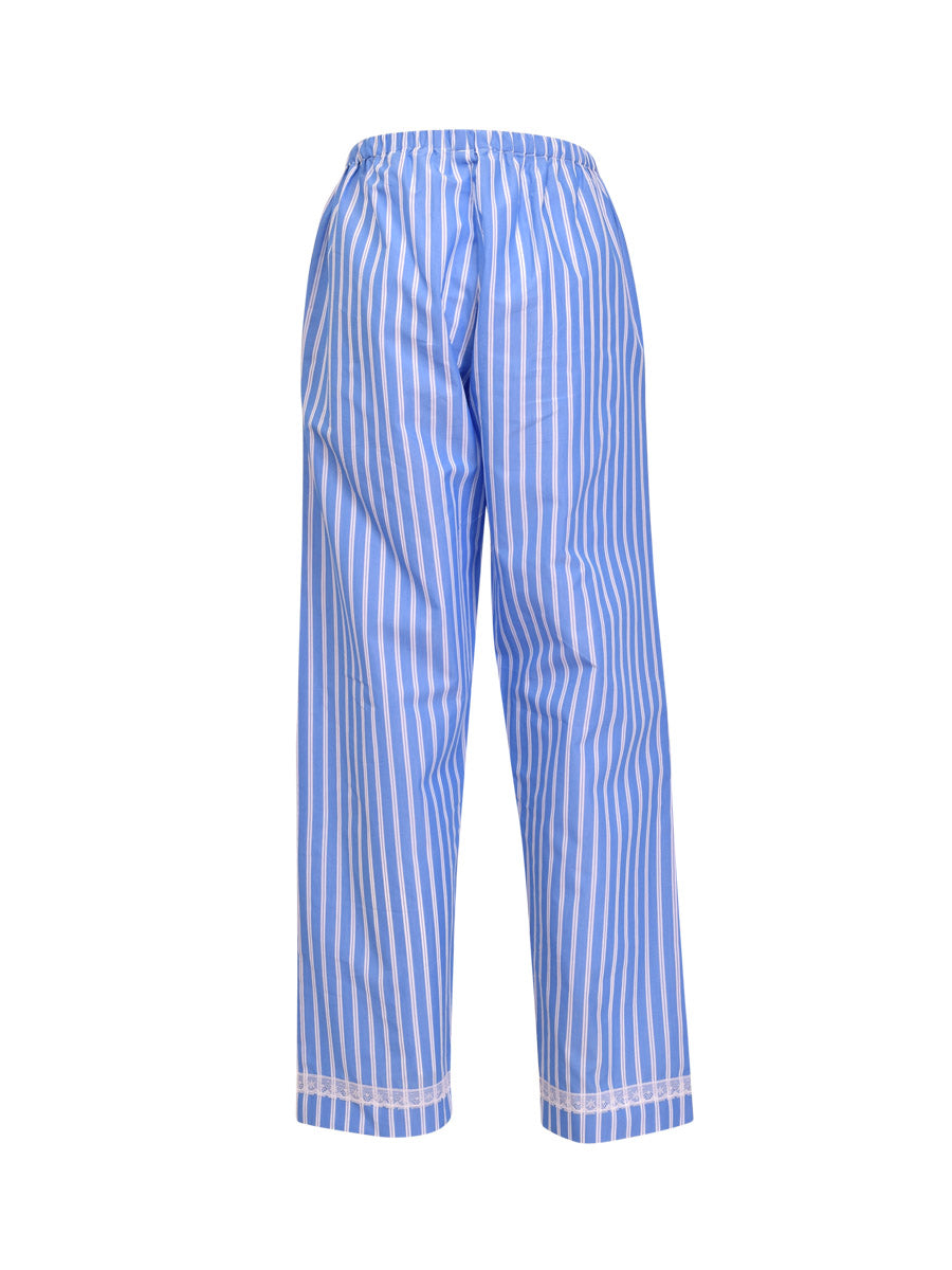 This Verdissima pajama set features a combination of male and female styling, with a button-up shirt top and long pants.