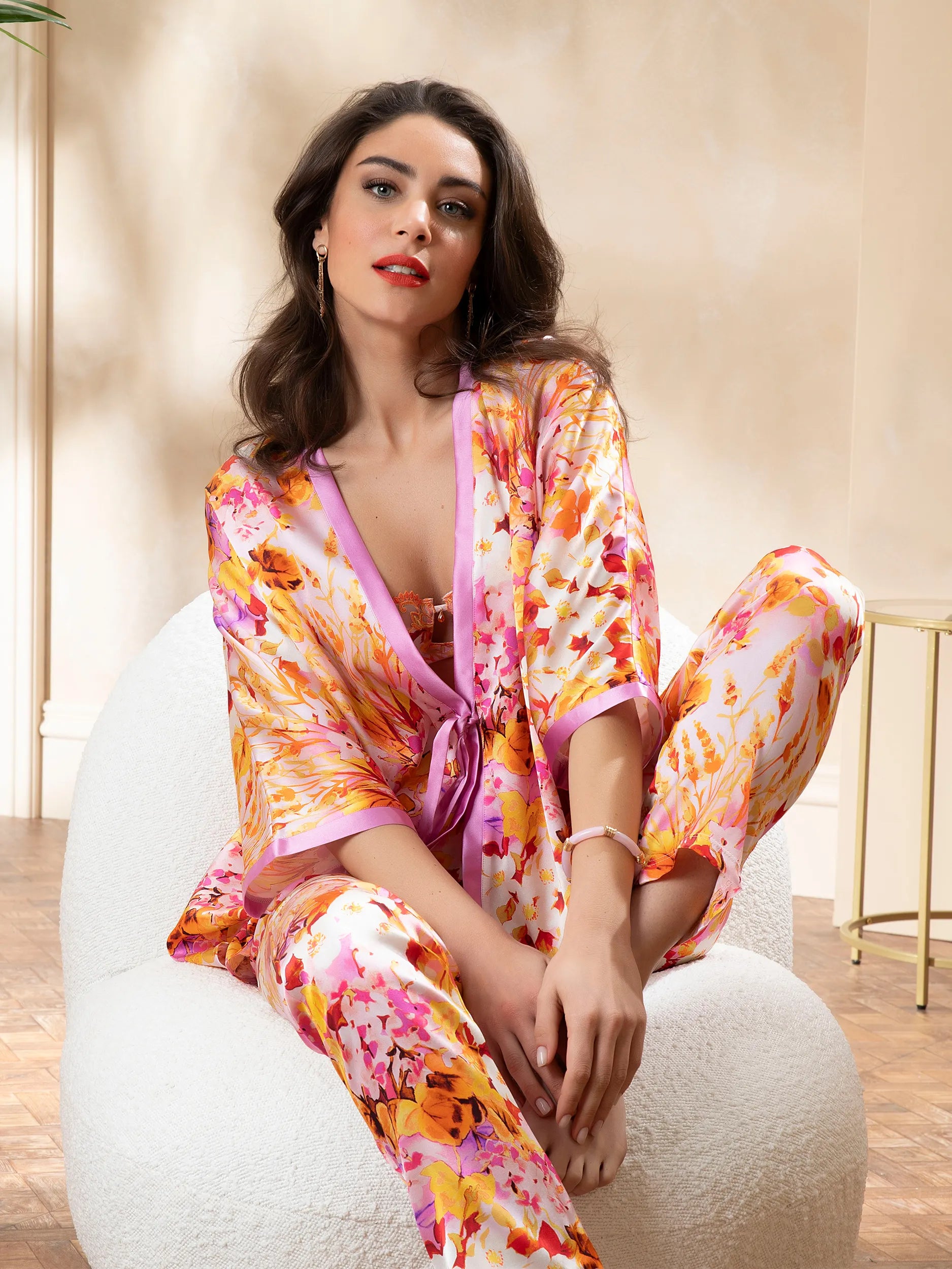 Women is wearing Jardins de Lumière Silk Kimono in combination with matching bra and panty sod separately. 