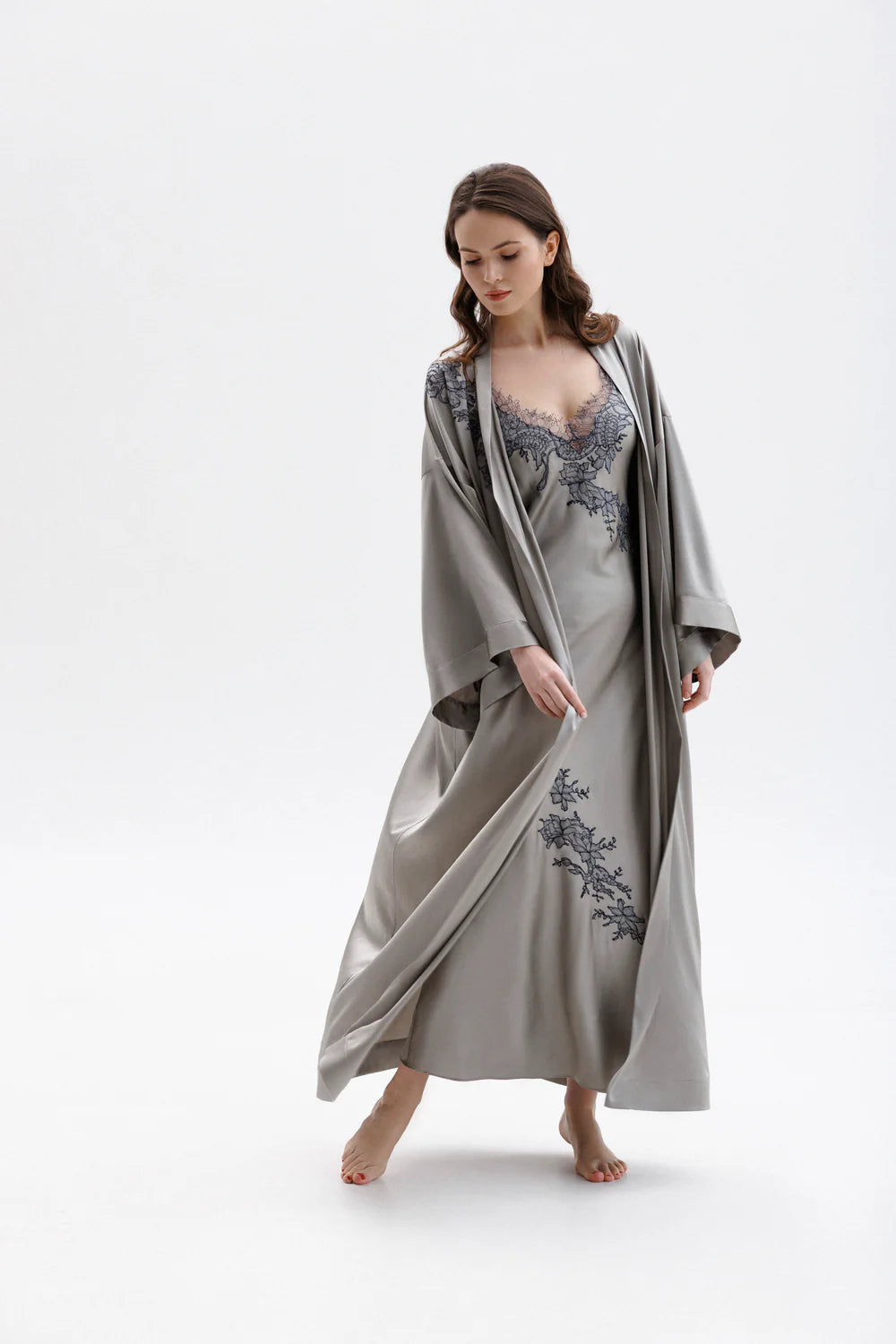 Woman wearing a silver silk sleeping  gown with floral embroidery showing the full figure picture with matching peignoir (sold separately)