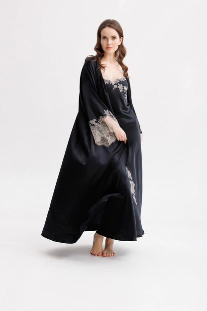 Woman wearing a black silk maxi slip dress with Leavers Lace details with matching long silk kimono (sold separately). Full front picture