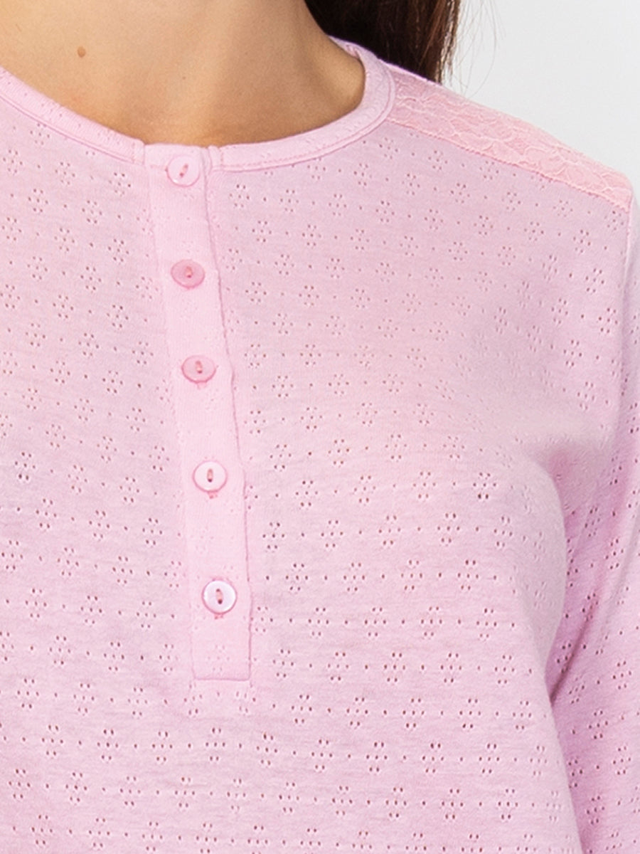 This premium pointelle cotton pajama set is crafted with a soft, subtly-textured fabric. Its long-sleeved top and trousers feature an elegant color palette that strikes a balance between comfort and style. 