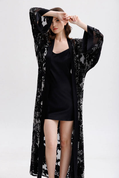 Woman wearing a black floral silk velvet kimono with matching nightgown (sold separately). Front picture