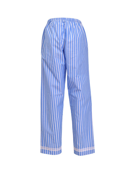 This Verdissima pajama set features a combination of male and female styling, with a button-up shirt top and long pants.