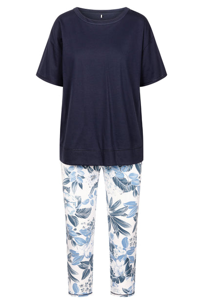 This two-piece pajama set from Rösch's Smart Casual collection is crafted from lightweight, supple single jersey cotton fabric, boasting a solid colored top and capri pants embellished with an indigo floral print.  Short sleeve  Wide crew-neck