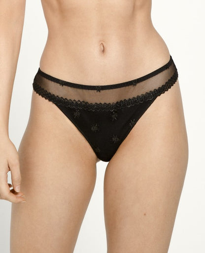 The Chantilly line by Louisa Bracq thong features a geometric border-line complemented by shimmering iridescent medallions, providing a sophisticated and refined air. 